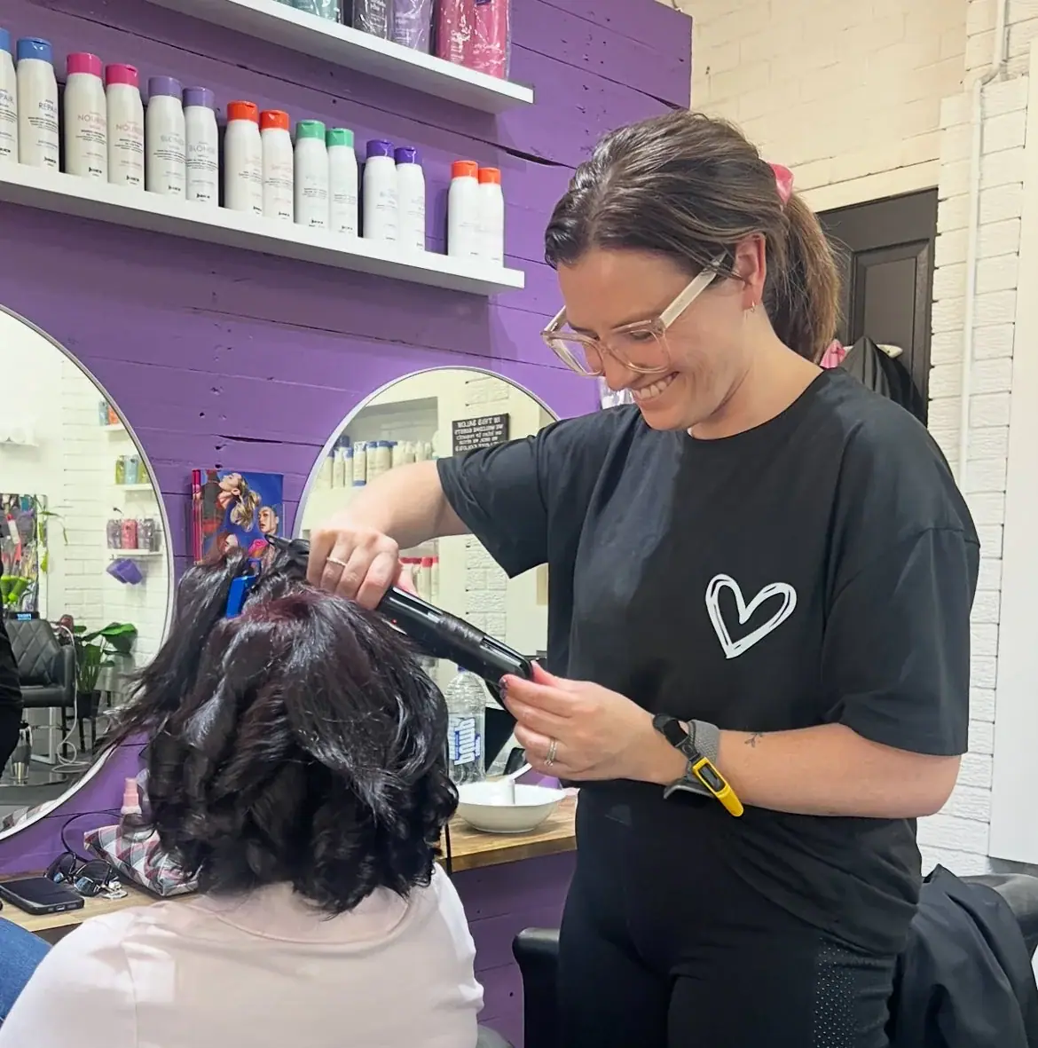 Jena working with a client at Hair Pinns